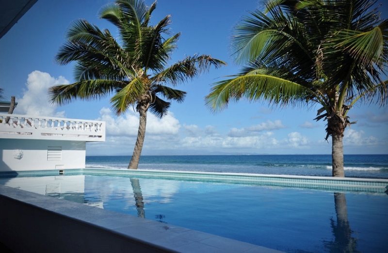 Bravo Beach Hotel swimming pool with ocean view and lounge chairs